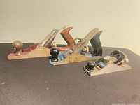 Side view of all three planes showing paint colors, handles and knobs