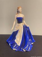 Front view of Royal Doulton Olivia figurine showing dress detail