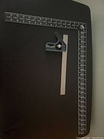 Large framing square and combination square visible