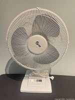 Front view of white Super floor fan showing 14" blade and grille