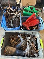 Overview of bins with tack, boots, grooming tote
