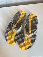 Top view of both sandals showing design, color and condition