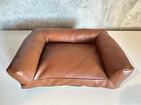 Top view of rectangular brown faux leather pet bed