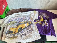 Overview of five T-shirts on table