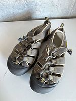 Top view of both Keen sandals showing size, color and webbing design