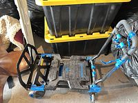 Top view of Mastercraft folding dolly showing deck surface, handle joints and wheels