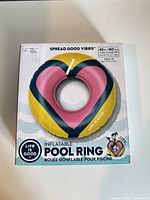 Front of sealed retail box displaying Life is Good inflatable pool ring