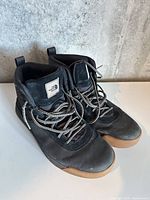 Top view of both shoes showing laces, uppers, and logo on tongue