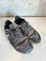 Top view of both shoes showing uppers and general wear