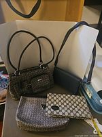 Four bags arranged: Guess shoulder bag, Guess pouch, Minicci handbag, navy blue shoulder bag