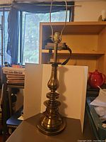 Full view of brass table lamp showing design and proportions