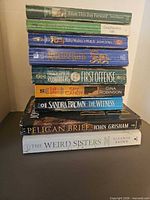 Full stack of nine books front view
