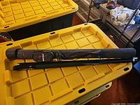 cue and case on storage bin
