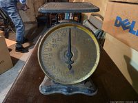 Front view showing dial, platform and base