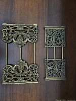 Collapsed adjustable book rack showing ornate brass side panels