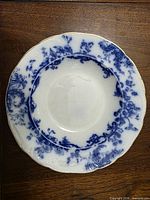 Top view showing Montrose flow blue pattern and scalloped gilt rim