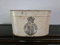 Cream oval Christys' London hat box front view