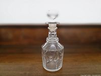 Full view of etched crystal decanter and stopper