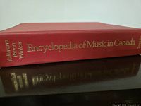 Spine view showing title and editors names in gilt on red cloth cover
