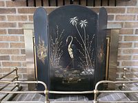 Full view of three-panel screen in front of fireplace