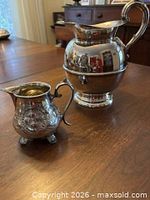 Pitcher and creamer showing exterior finish and gilt interiors