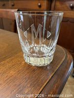 Front view of Baccarat Nancy pattern tumbler showing cut pattern, heavy base and M monogram