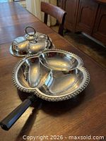 Dish open showing three compartments, lid placed beside