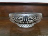 Side profile showing sterling silver overlay pattern on clear glass bowl