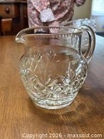 Small Waterford Boyne pattern lead crystal jug showing sawtooth rim, floral and lattice cuts, loop handle