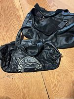 Both bags displayed on floor showing overall appearance and sizes