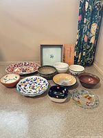 Group shot showing all 11 pieces including platter, bowls, glass dish, tile and presentation box