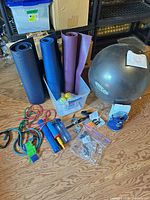 Group shot of all fitness items laid out on floor