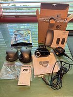 All items laid out: Logitech S120 box, two mice, webcam with cable, Panasonic headset package, manuals