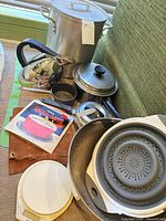 Group shot of all cookware, scale, steamer, heat diffuser