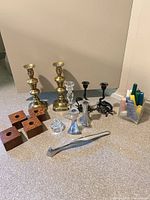 Group shot of all candlesticks, holders and snuffer