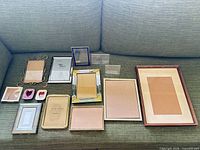 All thirteen frames laid out on couch for overview