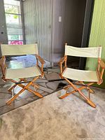 Both director chairs side by side, showing overall condition and materials