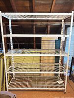 Front view showing entire shelving unit and five wire shelves