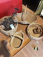 Group shot of all baskets, tray, pinecones