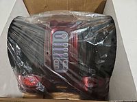 Foot massager in foam packaging with plastic wrap, top view