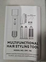 Manual cover showing Multifunctional Hair Styling Tool DM-06 and attachment diagrams