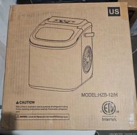 Front of sealed box showing illustration and model number