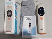 Thermometer with display on, storage pouch, quick start guide and box