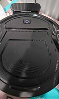 Top view of Lefant robot vacuum on charging dock