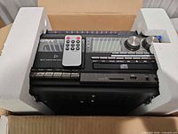 Unit in original foam packaging with remote on top