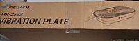 Factory-sealed box labeled Merach MR-2533 Vibration Plate