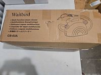 Retail box showing brand, model and illustration of steam cleaner
