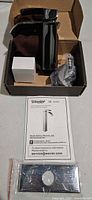 Faucet, hoses, mounting plate, hardware, instruction sheet inside box