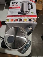 Boxed Ninja Precision Temperature Kettle with jug and base visible