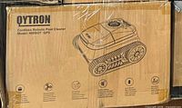 Original carton showing Qytron Cordless Robotic Pool Cleaner Model NIXBOT QP5 graphics and specs